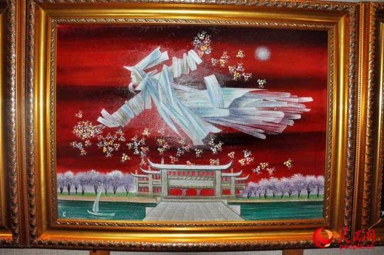 《飞翔的天使》。画中的建筑象征着中国，飞翔的天使护佑着中国及中国人民。(摄影 人民网李政杰)