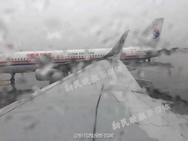 上海虹桥机场两架东航客机机翼发生碰擦