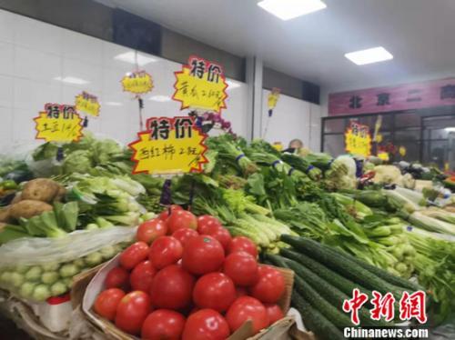 图为北京西城区一家菜市场。 谢艺观 摄